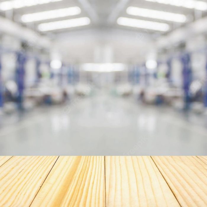 empty-wood-table-top-with-car-service-centre-auto-repair-workshop-blurred-background_293060-5173