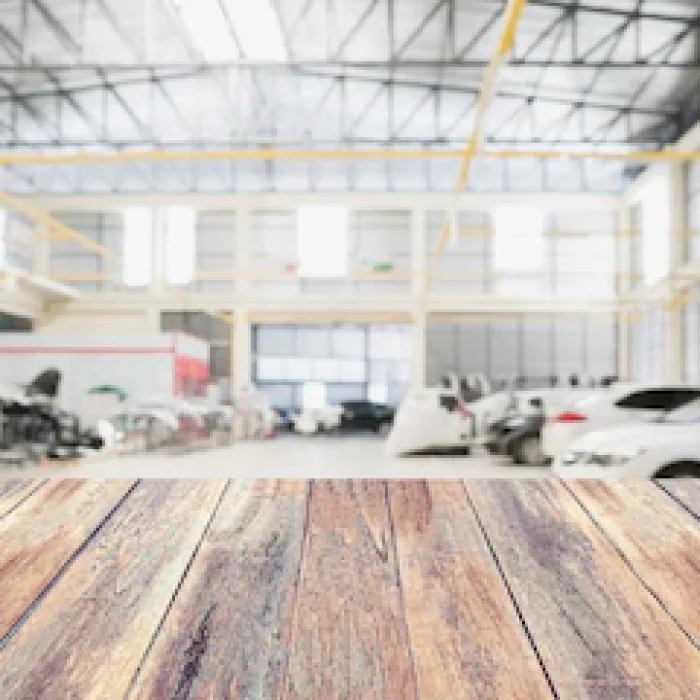 wood-table-top-with-car-repair-service-centre-interior-blurred-background-create-montage-auto-product-display_293060-2986